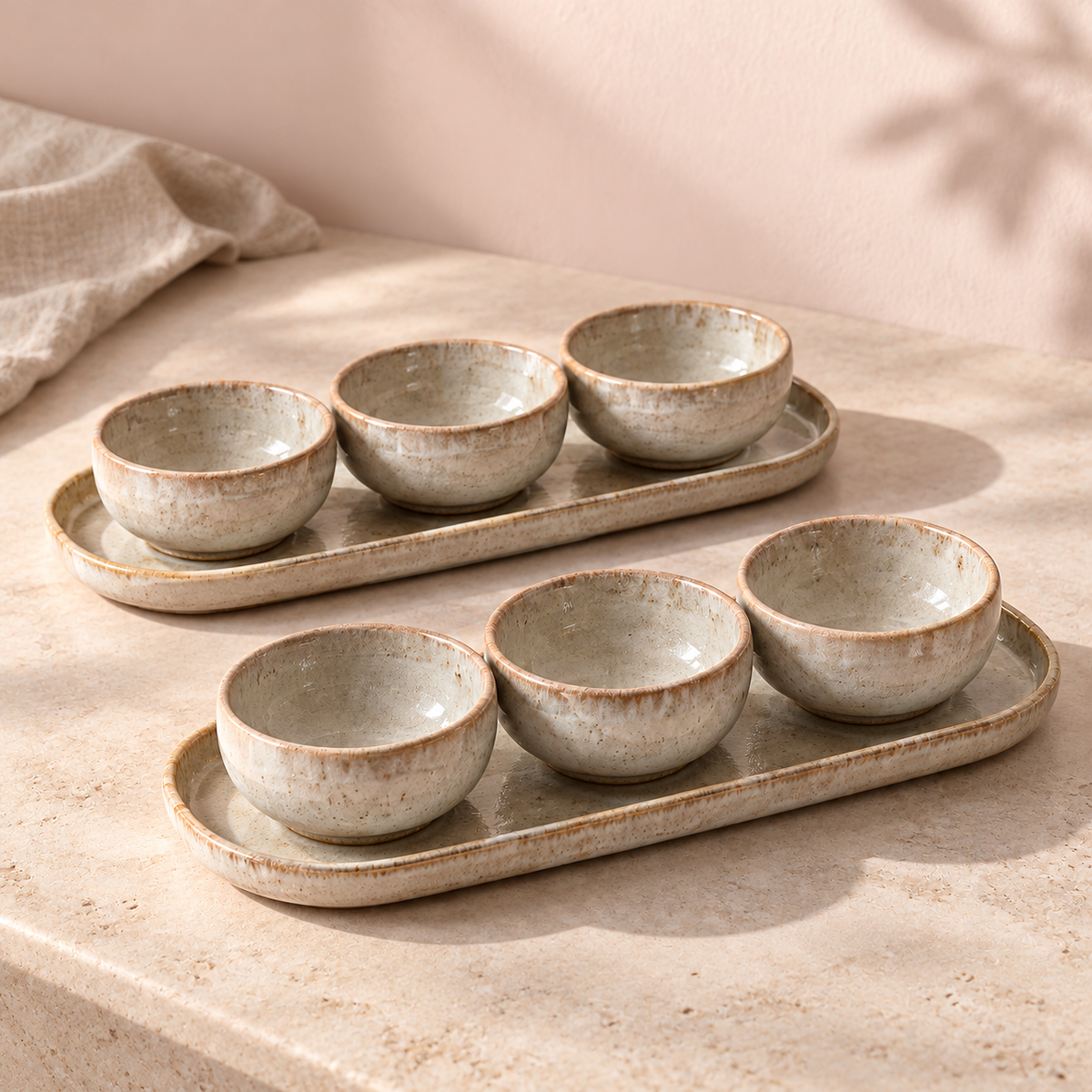 Fossil Condiment Bowl Set in pale fossil grey — table setting